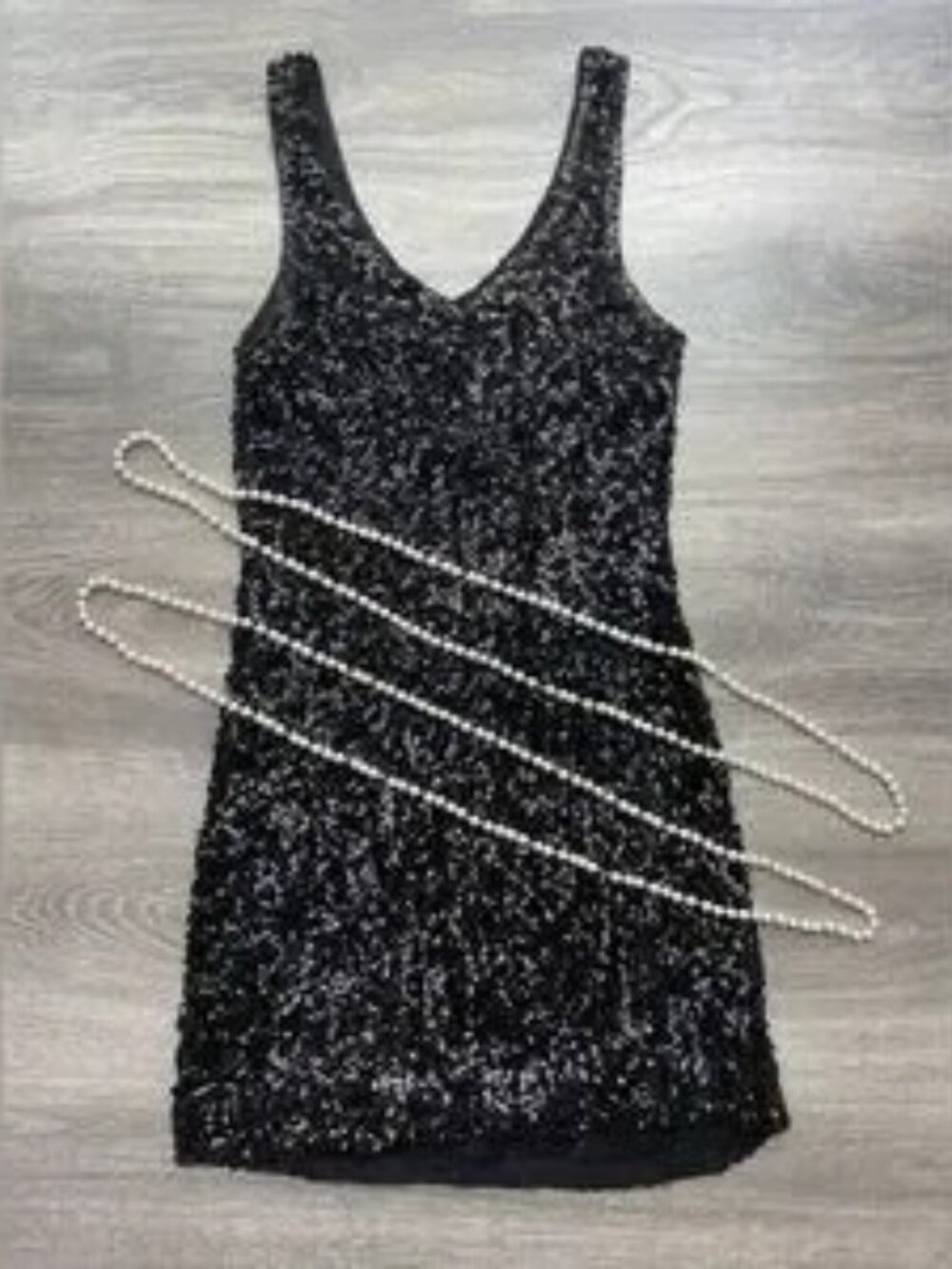 Black Sequin Sleeveless Dress with costume pearls